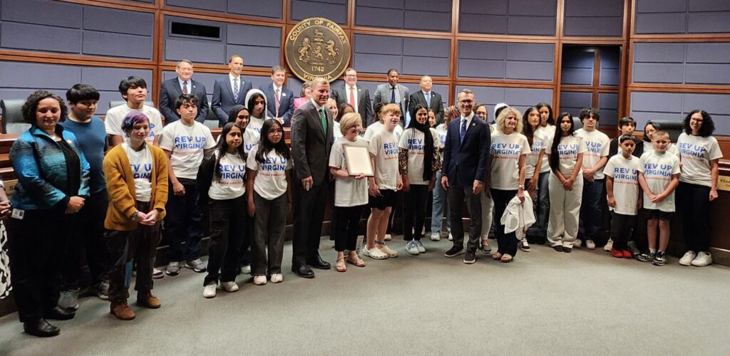REV UP Virginia supporters stand with members of the Fairfax County Board of Supervisors after accepting the Board's Disability Voting Rights Week Proclamation
