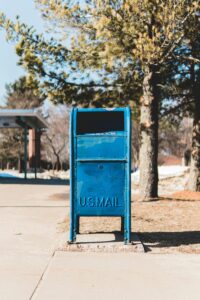 blue mail collection box embossed with text: U.S. Mail