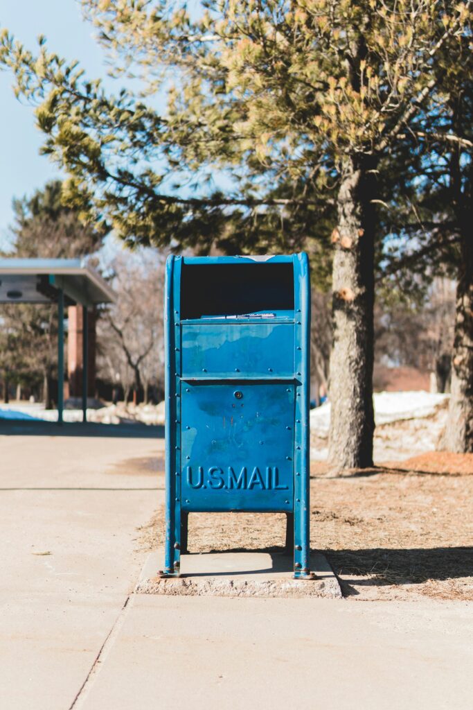 blue mail collection box embossed with text: U.S. Mail